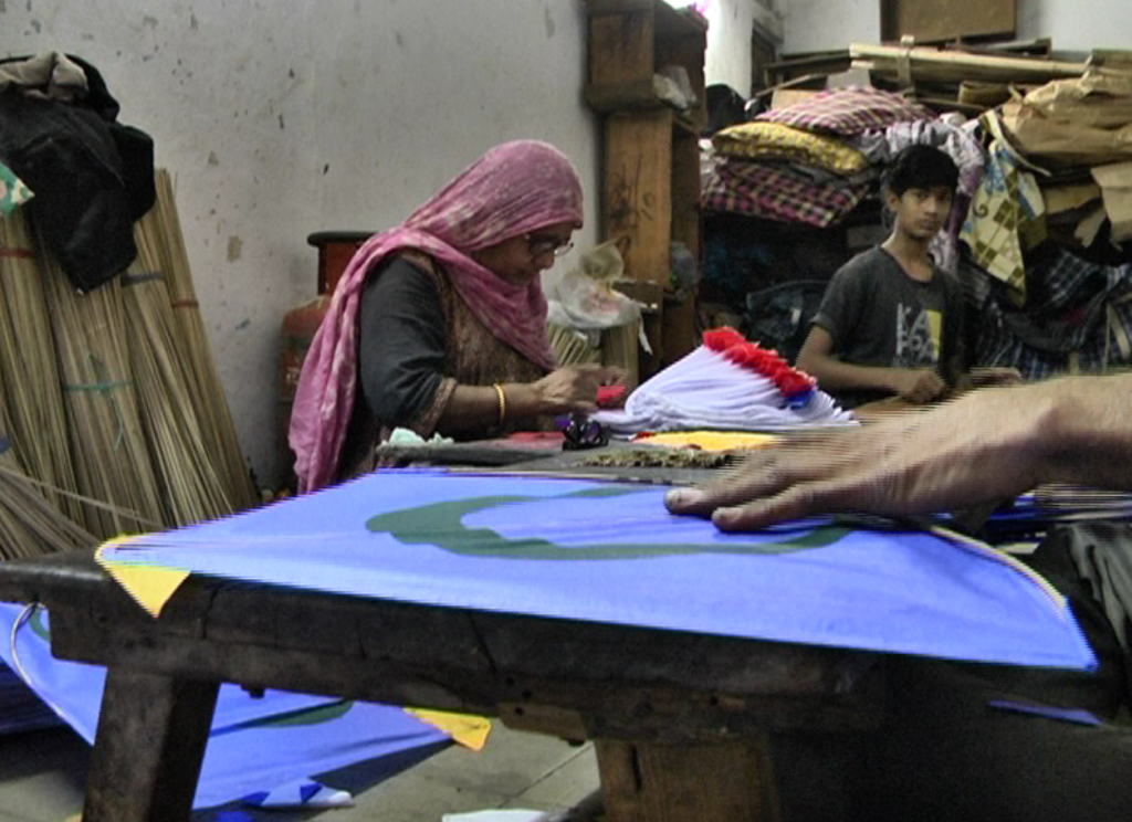 Muslim family making Kites